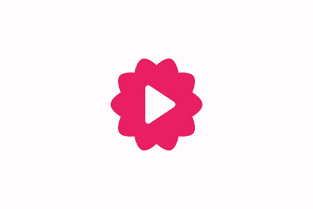 Fliki logo. A pink stylized flower icon with a white play button in the center on a white background.