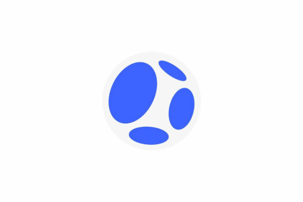 Atoms.dev logo. A minimalist circular logo featuring four varied blue oval "atoms" floating within a light grey sphere.